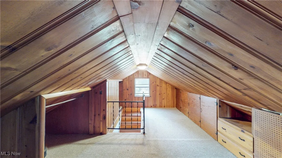 Attic featuring an upstairs landing