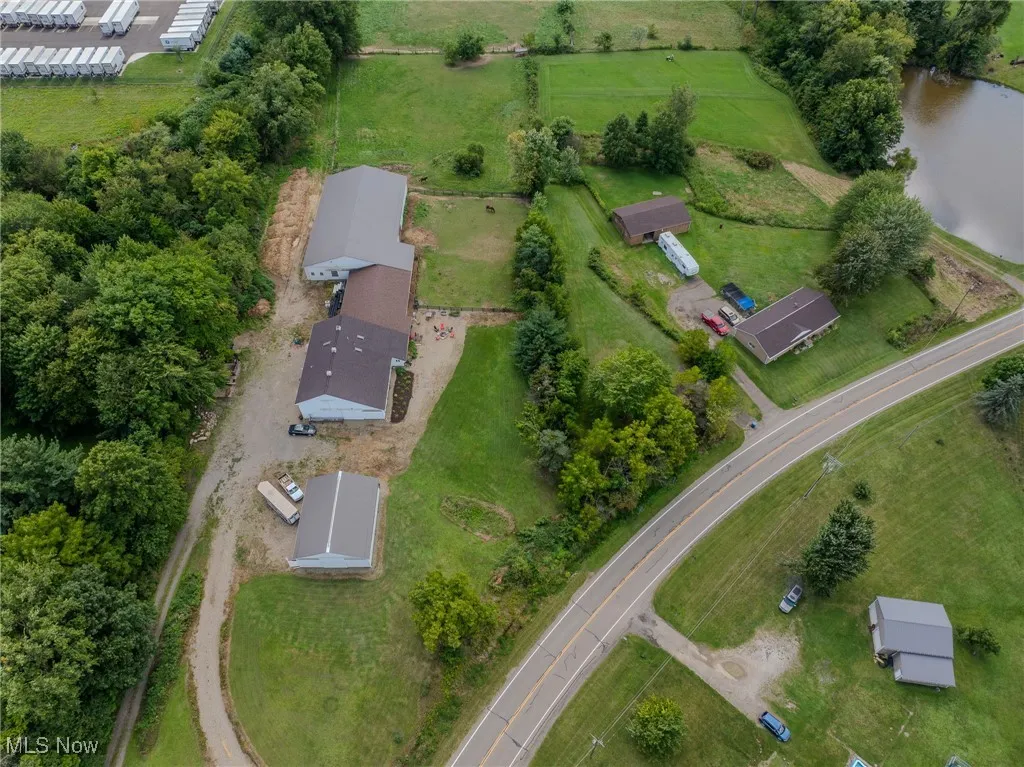 Aerial overview of property's location with a large body of water