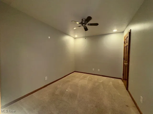 Empty room featuring a ceiling fan, carpet, and recessed lighting
