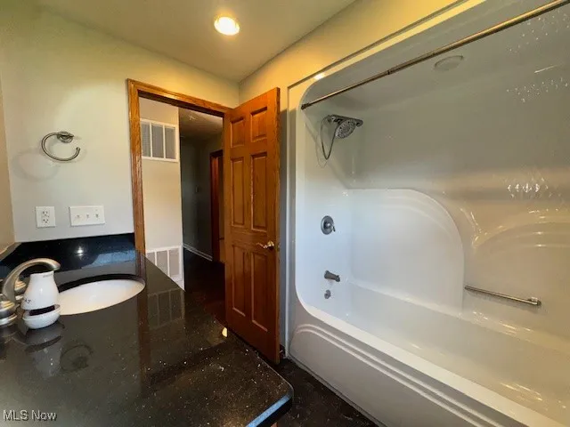 Full bathroom featuring shower / bath combination
