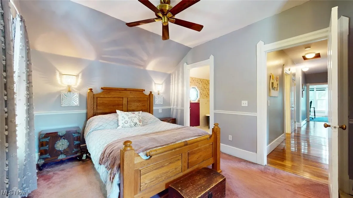 Primary Bedroom with baseboards and a ceiling fan
