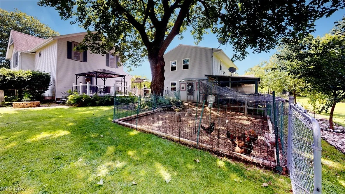 Back of house with a garden and cute Chicken Coup