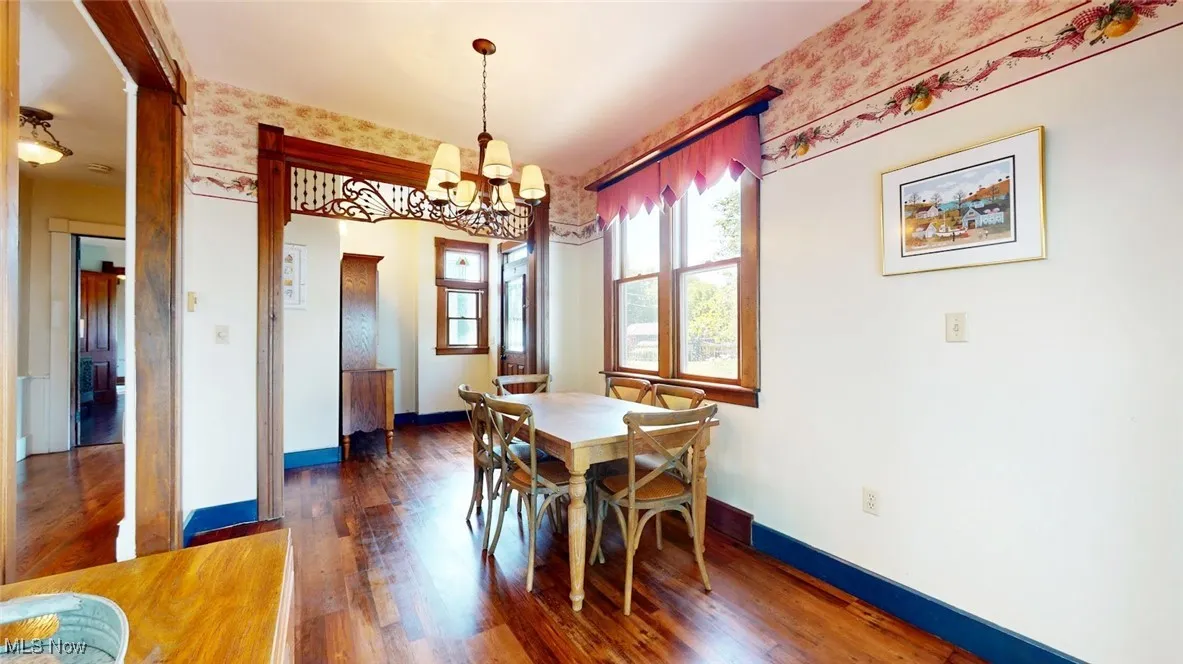 Dining room with a chandelier and wood finished floors