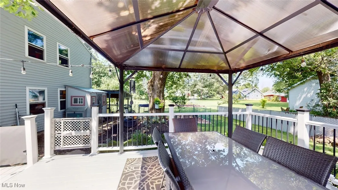 View of patio / terrace featuring outdoor dining area and a wooden deck