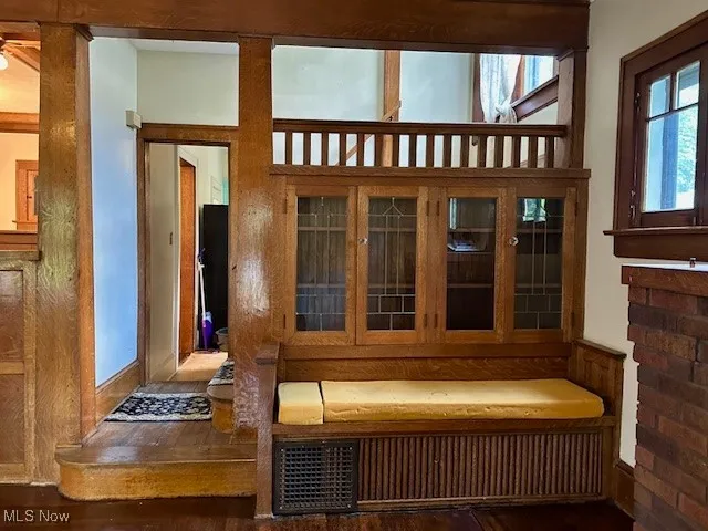 Detailed view of wood finished floors and ceiling fan