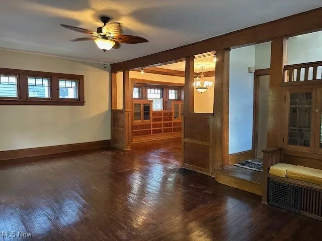 Unfurnished living room featuring hardwood / wood-style floors and healthy amount of natural light