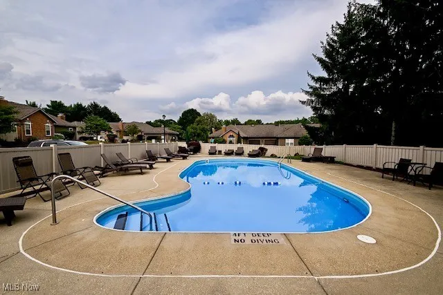 Community pool featuring a patio area
