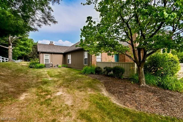 Rear view of property with a chimney