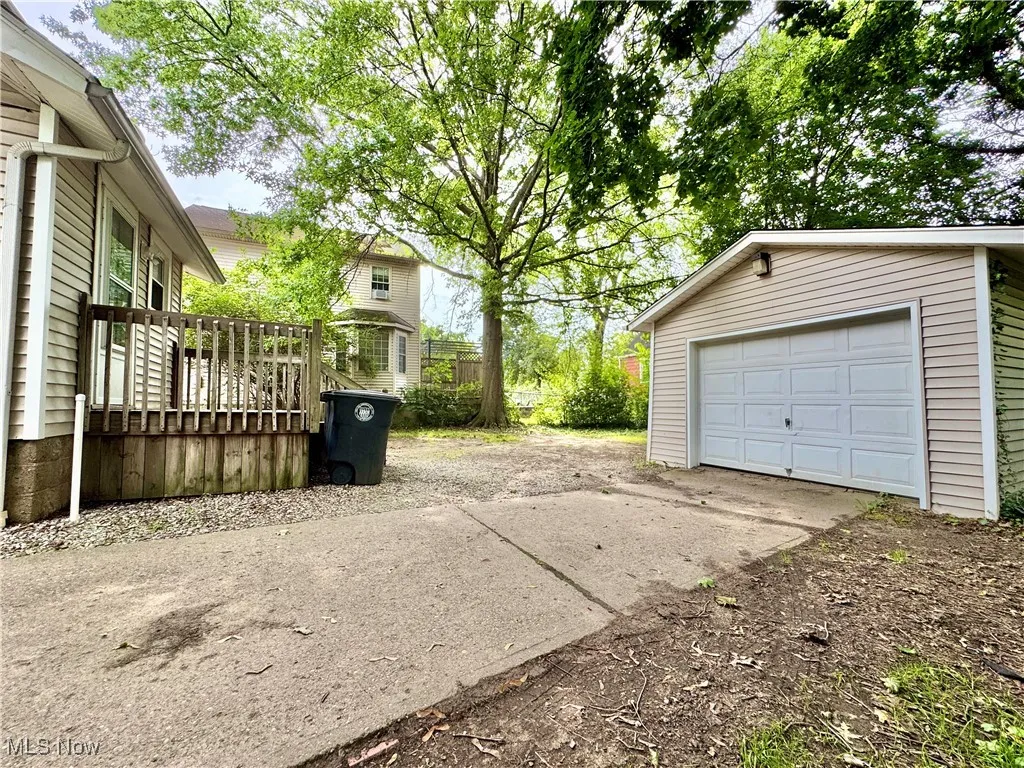 Detached garage featuring driveway