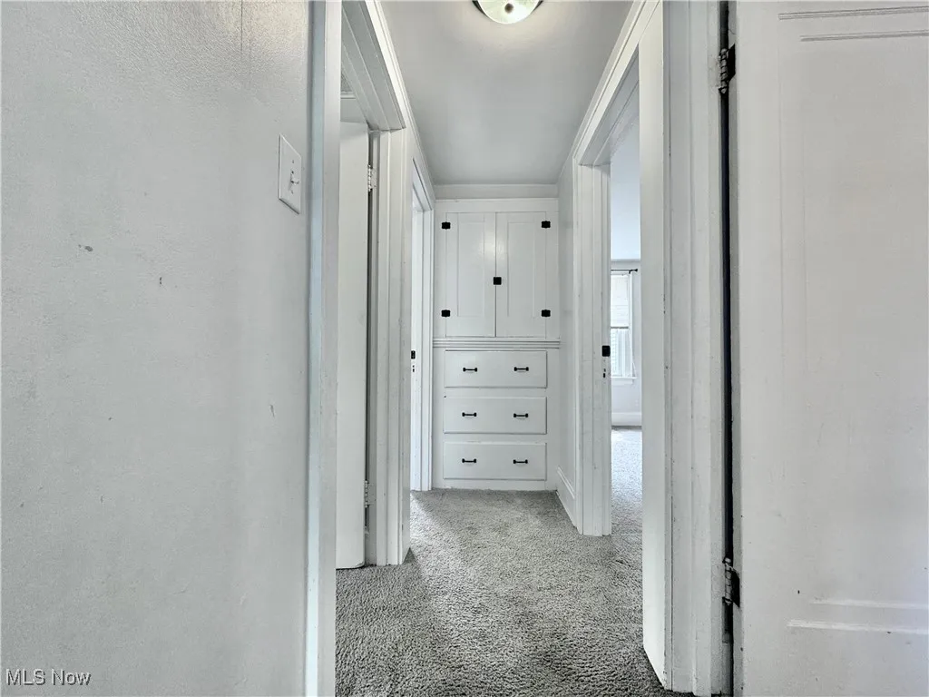 Hallway with carpet