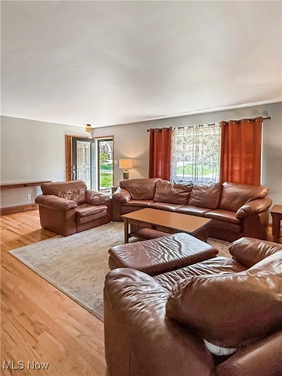 Living area featuring healthy amount of natural light and wood finished floors