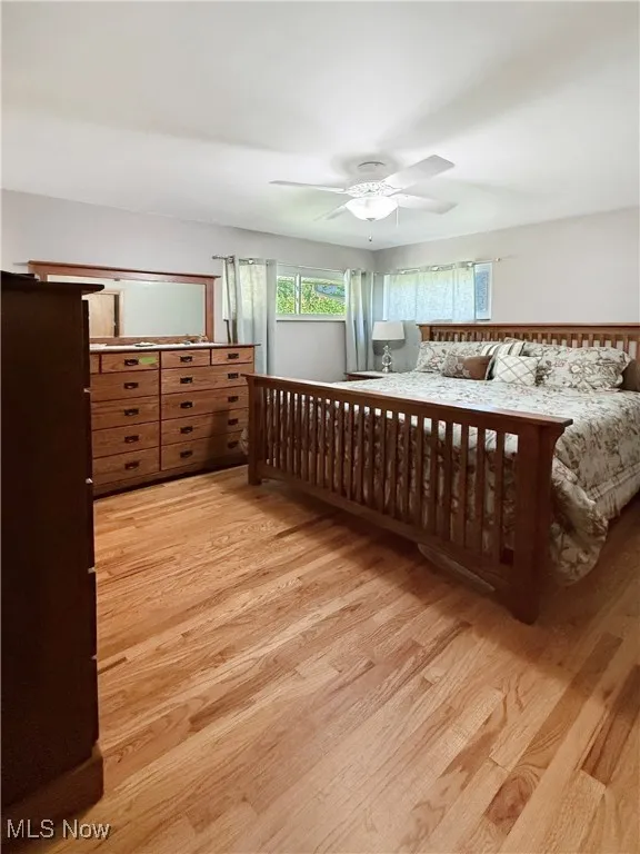 Bedroom featuring light wood-style floors and ceiling fan