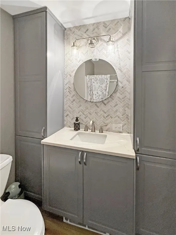 Bathroom featuring vanity and toilet