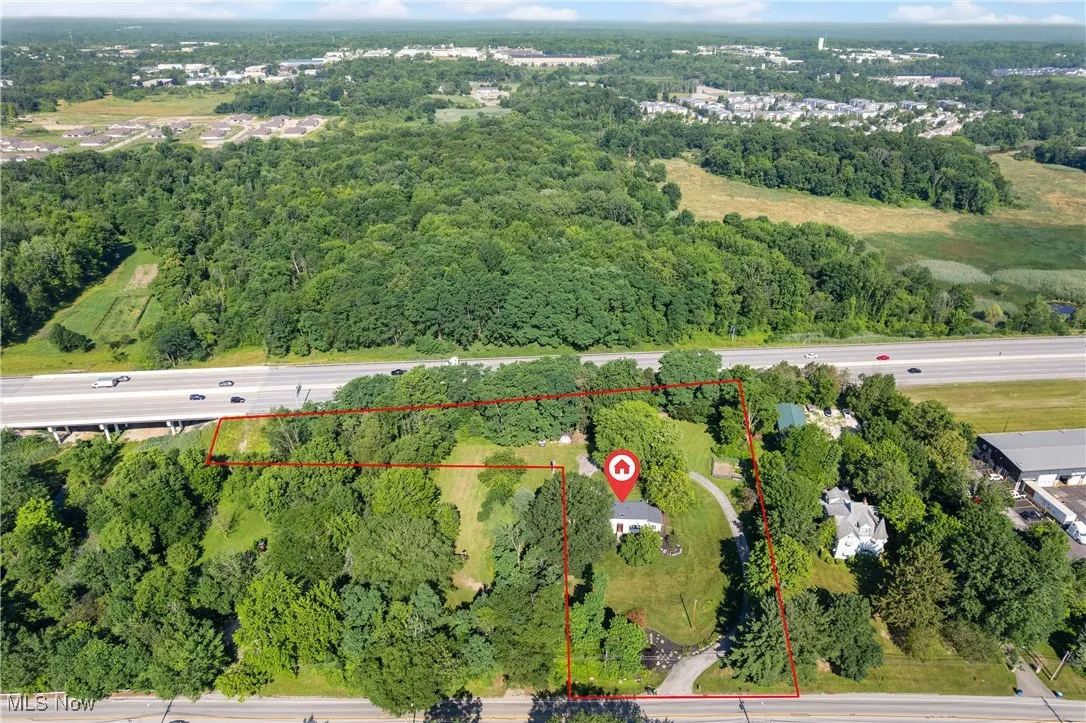 Aerial overview of property's location featuring property parcel outlined