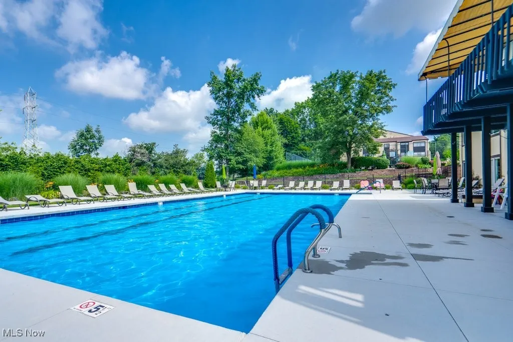 Community pool with a patio area
