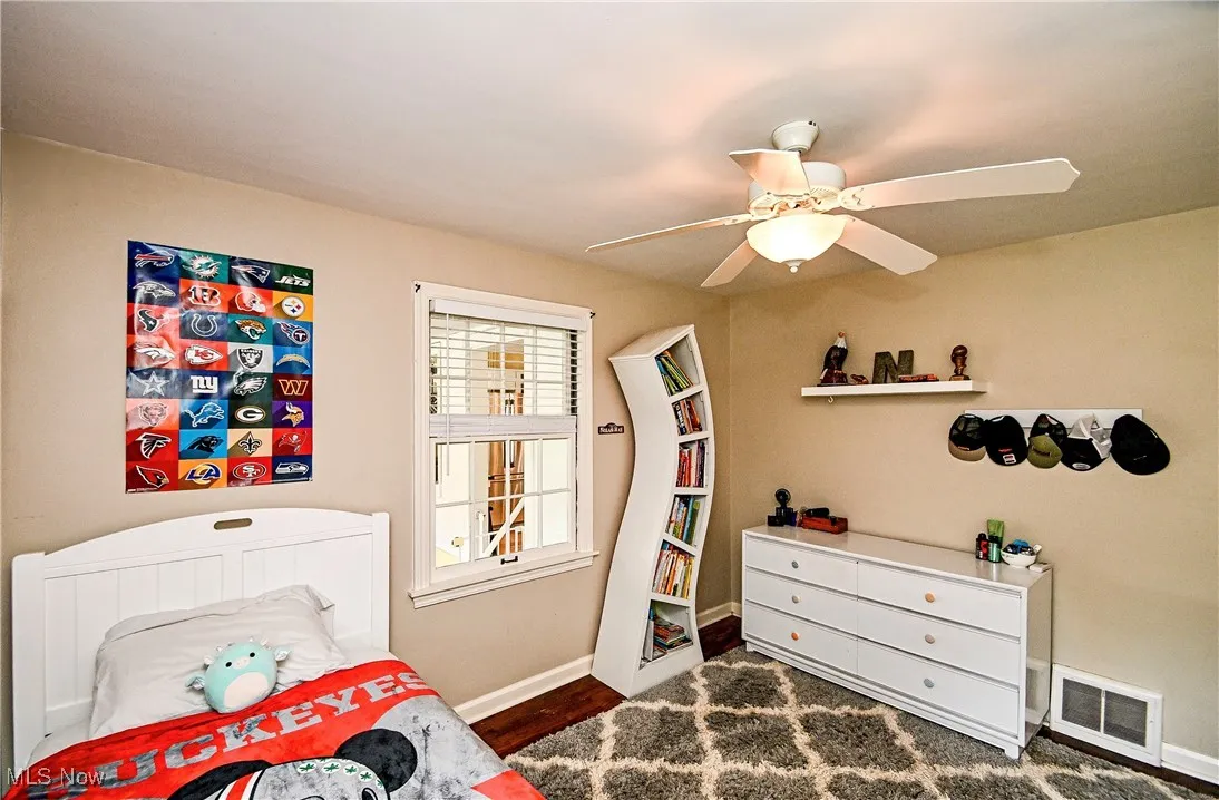 Bedroom featuring ceiling fan and wood finished floors