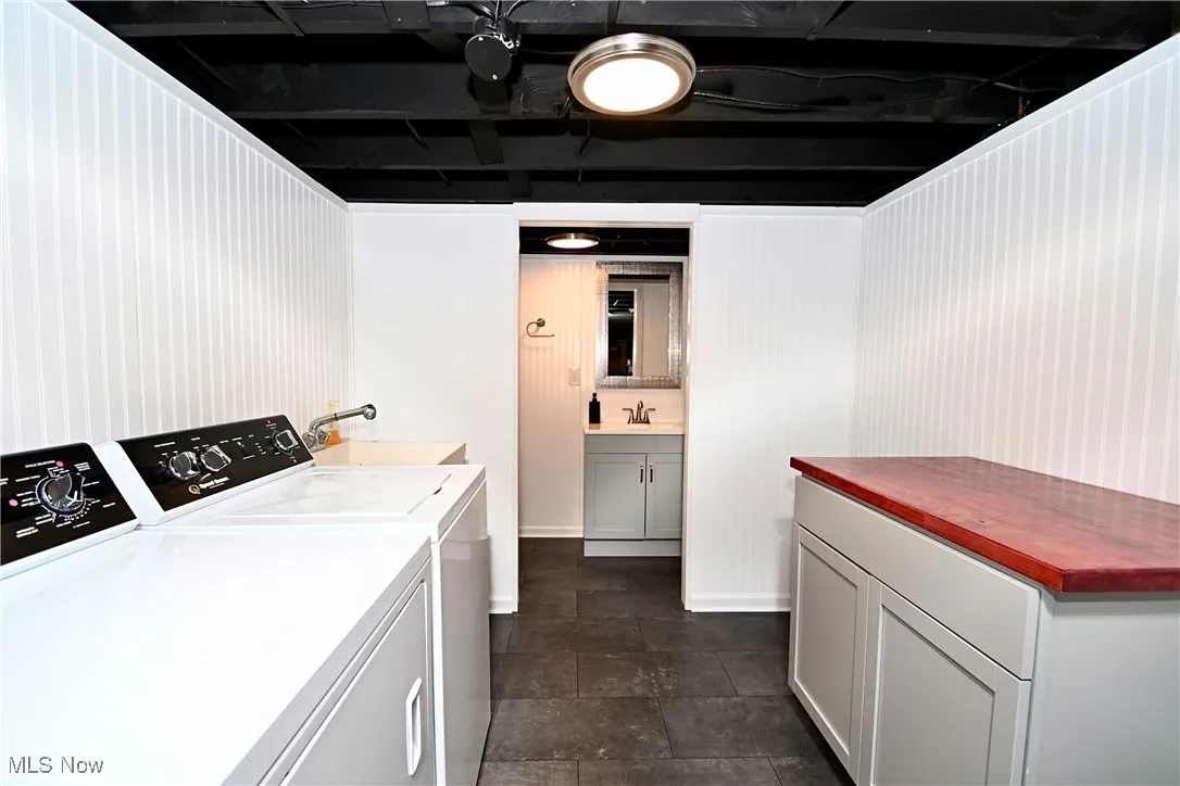 Laundry room featuring a sink and washer and clothes dryer