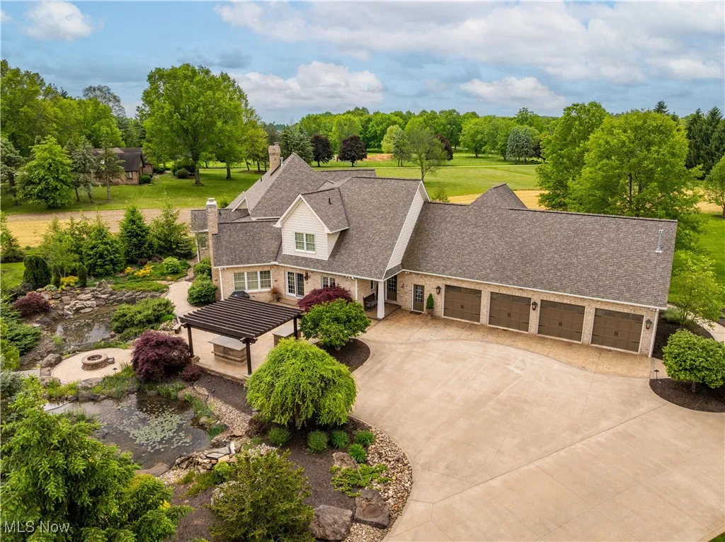 View of the driveway and attached four-car oversized garage.