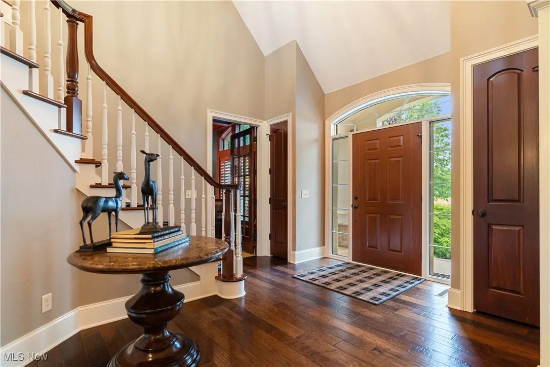 Foyer entrance with a beautiful spiral staircase.
