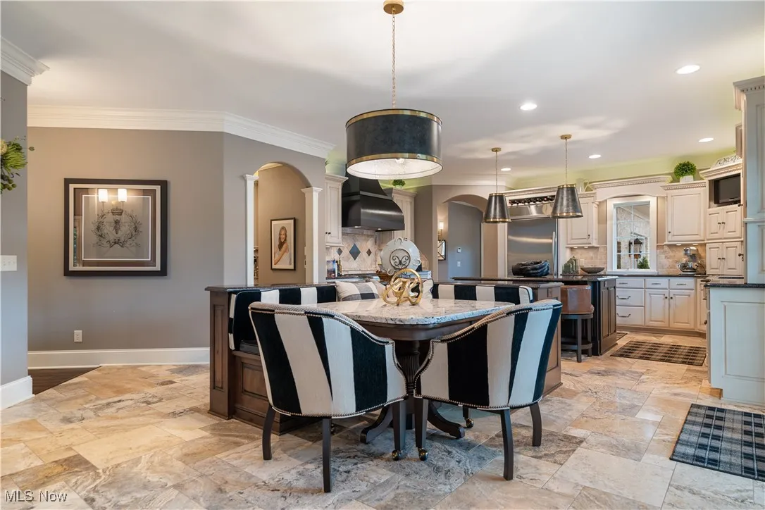 The bright and spacious eat-in kitchen opens to the great room and has a slider to the rear, as well.