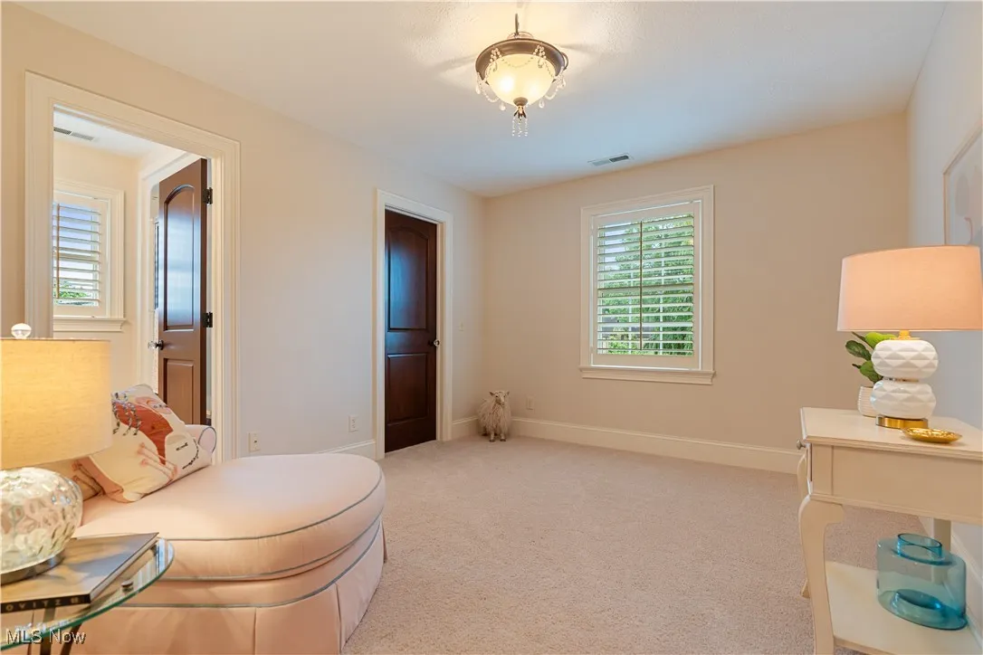 Bedroom 4 featuring light carpet