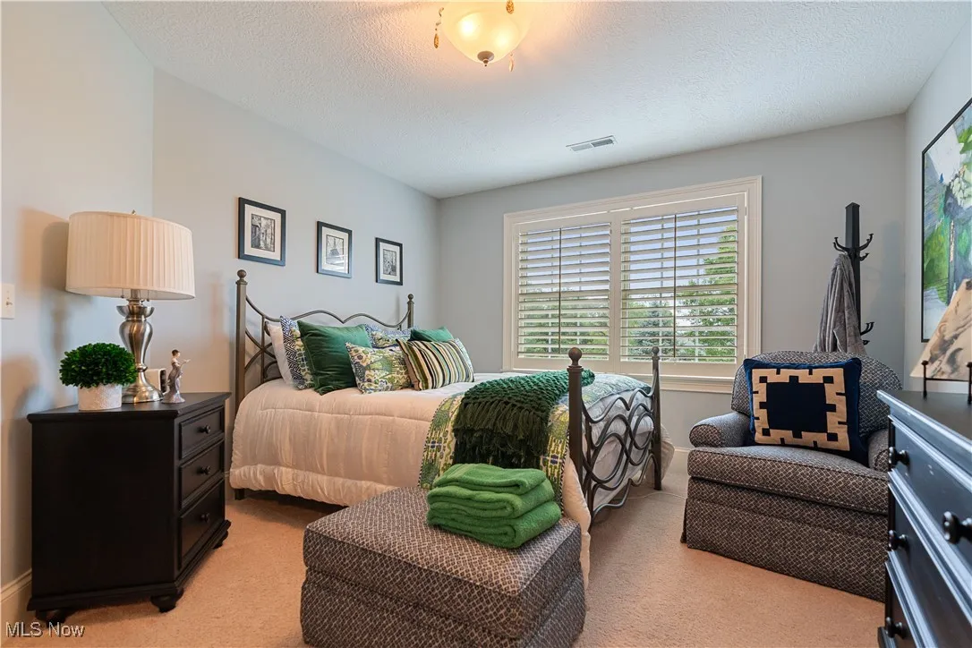 Bedroom 3 featuring light carpet