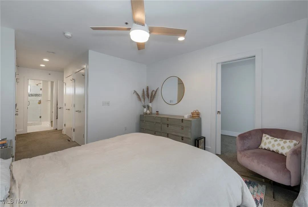 Carpeted bedroom with recessed lighting, ceiling fan, a closet, and connected bathroom