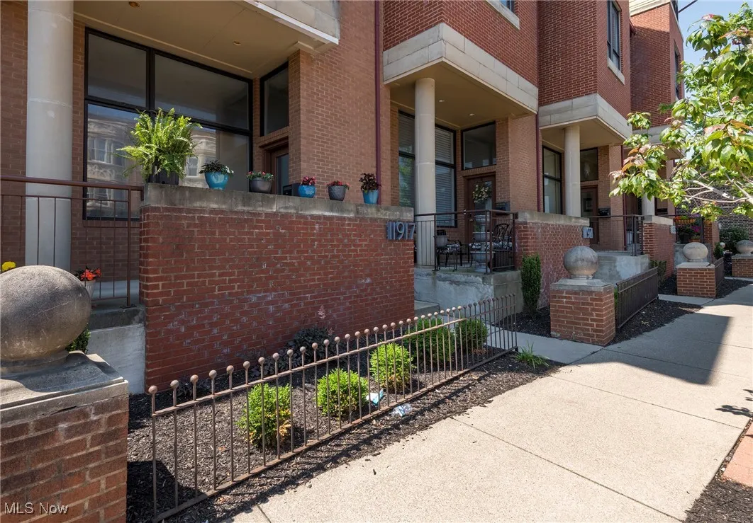 View of exterior entry with brick siding