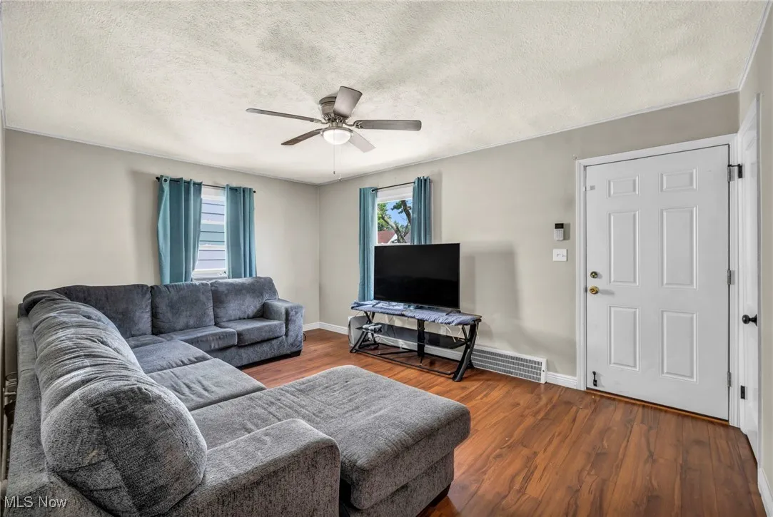 Living area featuring a ceiling fan