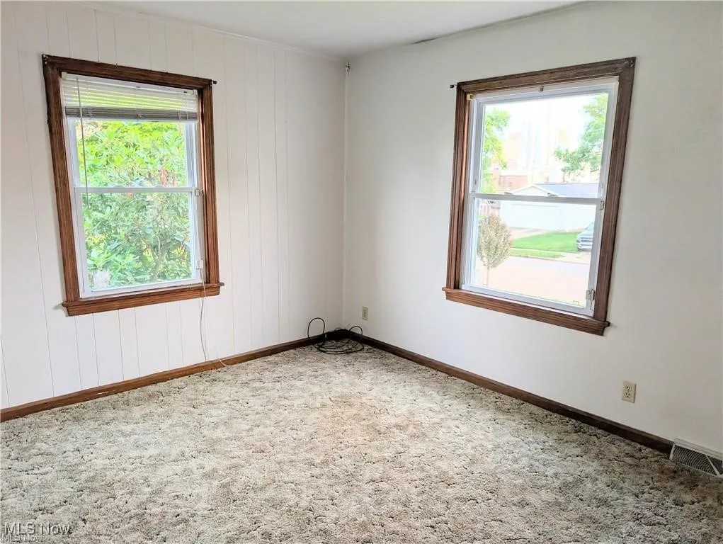 Empty room featuring carpet floors