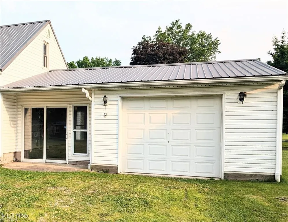Garage featuring driveway