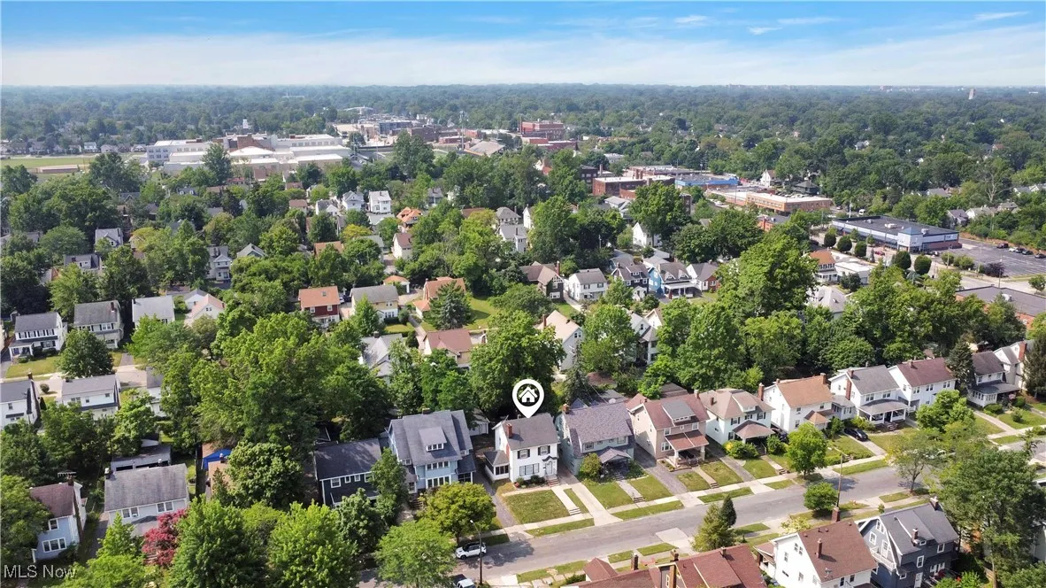Aerial view of property's location with nearby suburban area