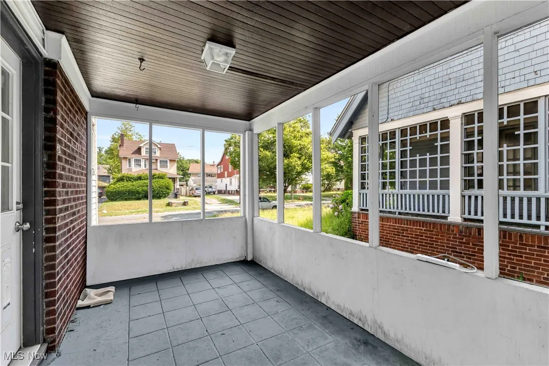 Unfurnished sunroom with a residential view
