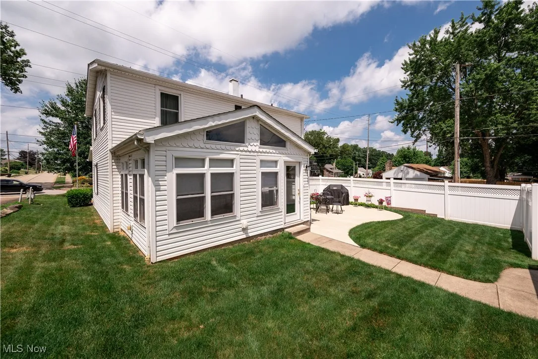 Rear view of house featuring a patio area