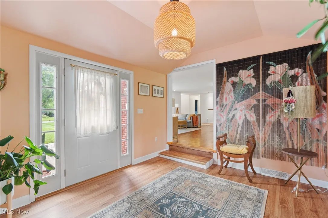 Foyer featuring wood finished floors