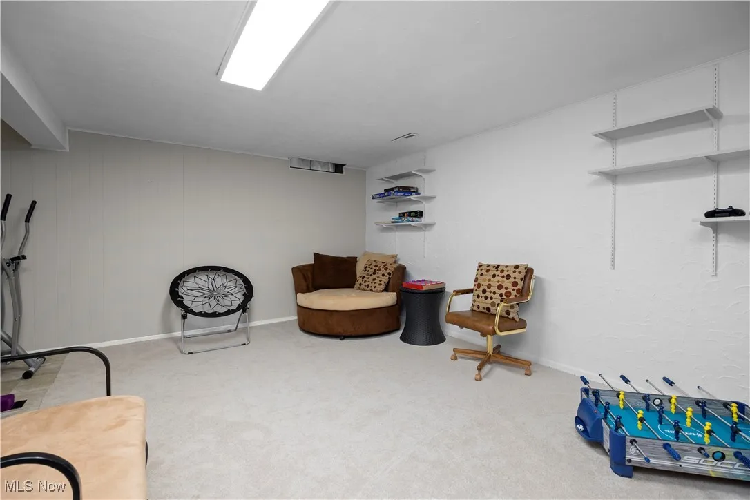Sitting room featuring carpet floors