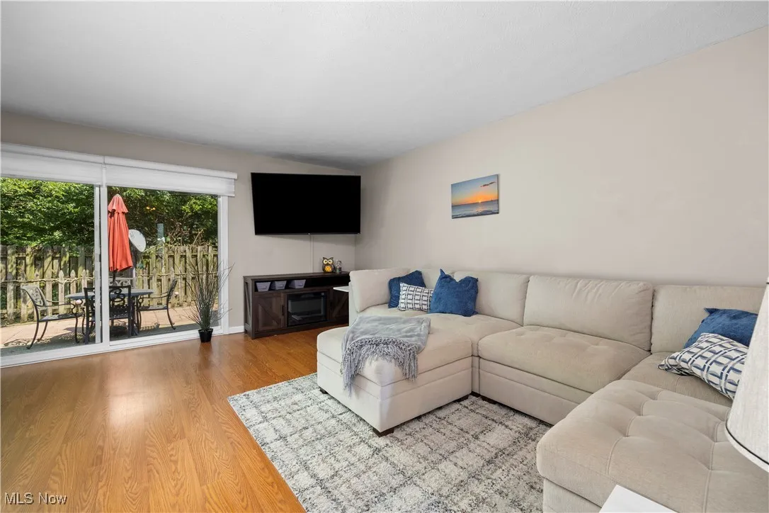Living room featuring wood finished floors and baseboards