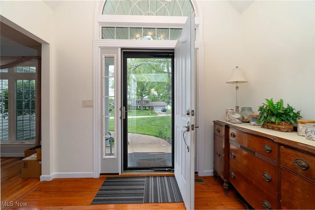 Entryway with light wood finished floors and plenty of natural light