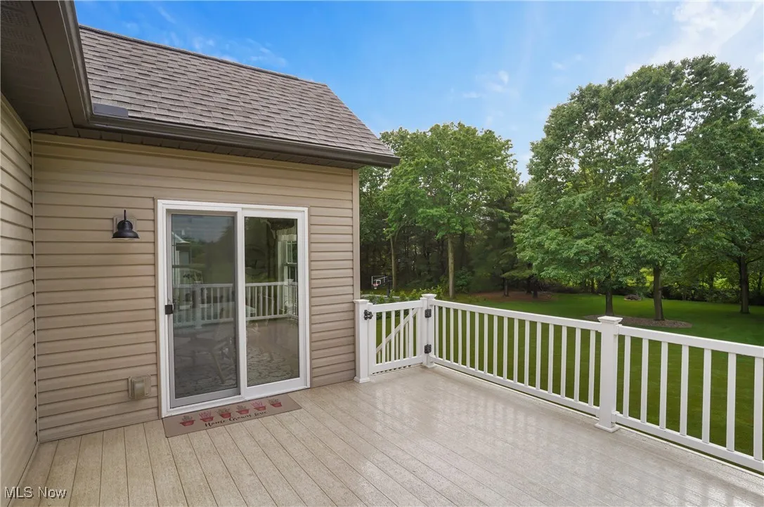 Wooden deck featuring a yard