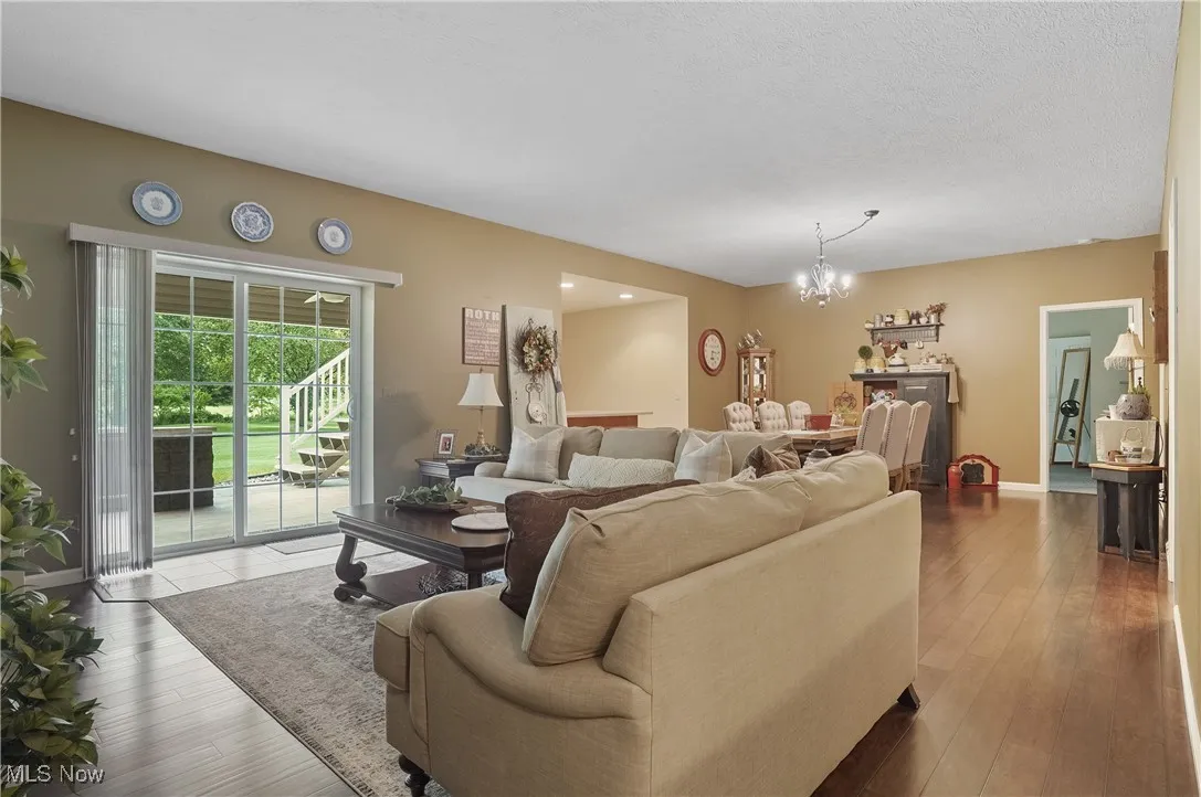 Living area featuring a chandelier and wood finished floors