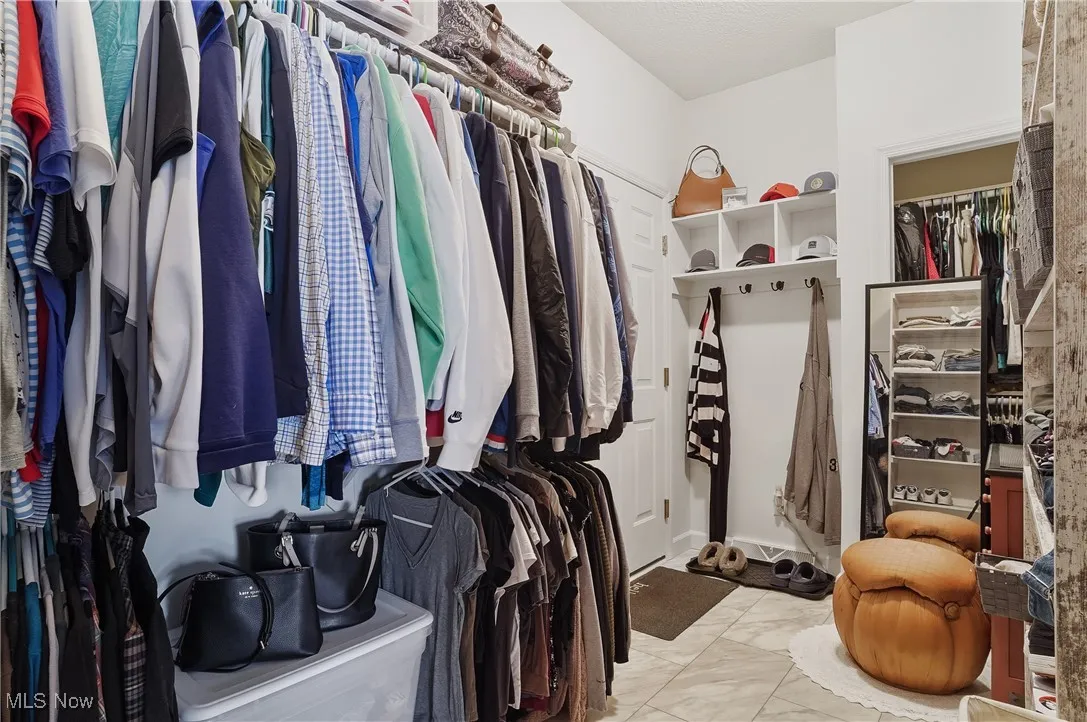 Spacious closet with marble look tiles
