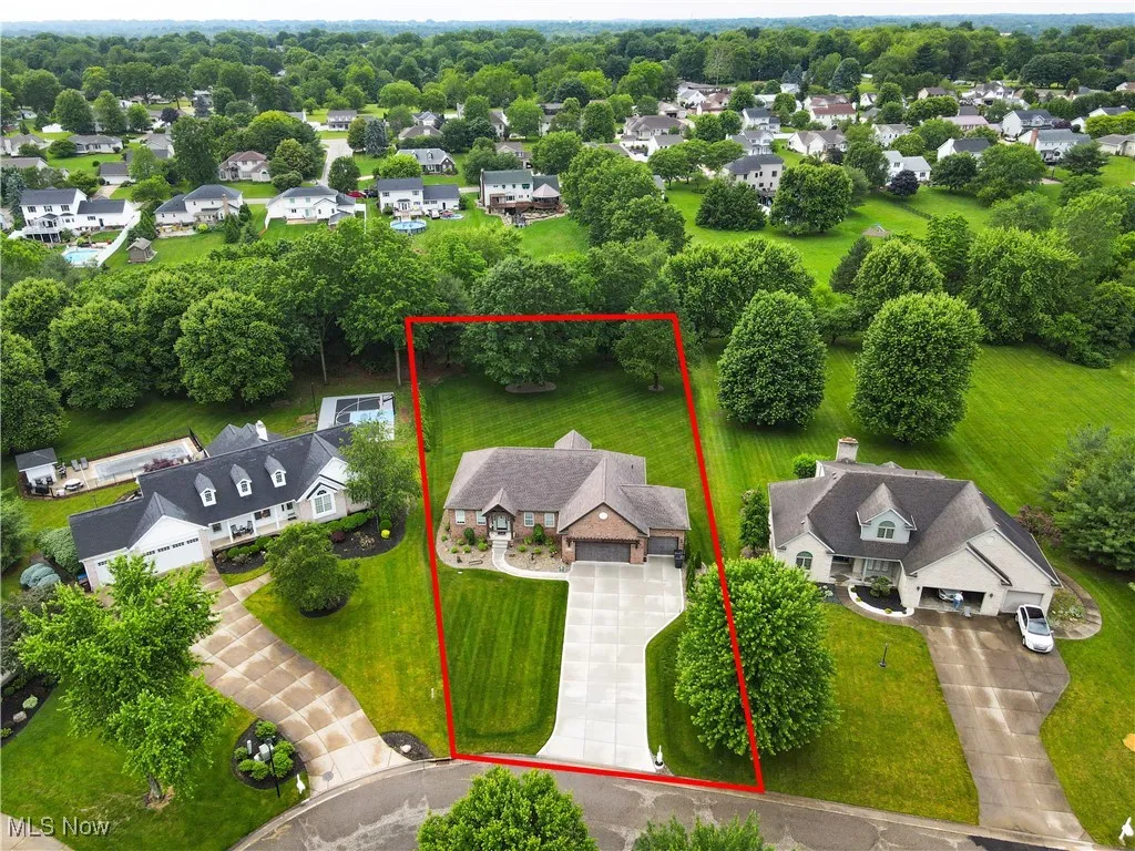 Aerial perspective of suburban area with property parcel outlined