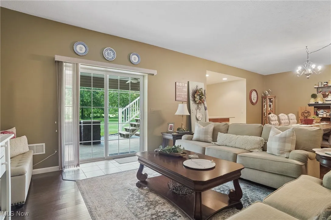 Living area with a chandelier and wood finished floors