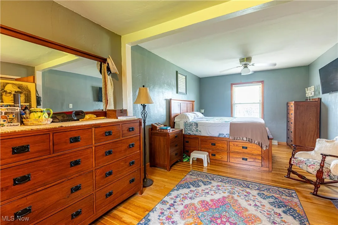 Bedroom with light wood-type flooring and ceiling fan