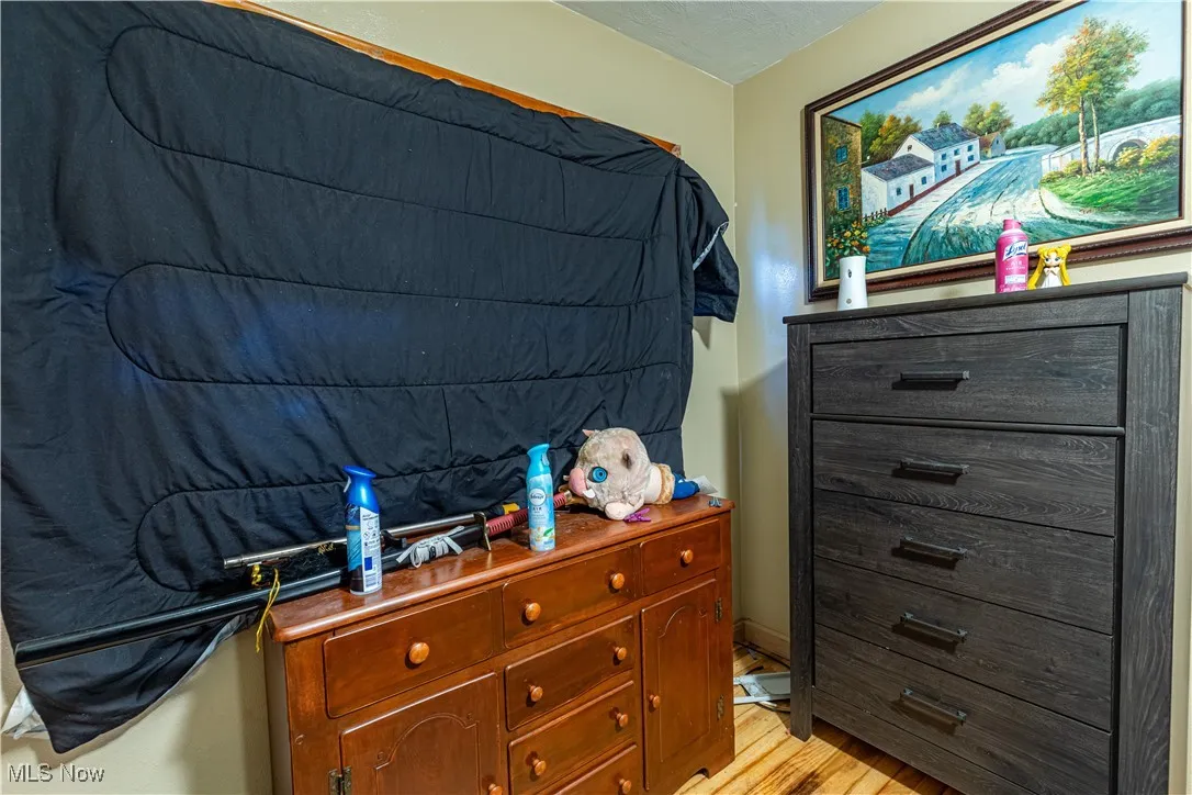 Bedroom with light wood-style flooring