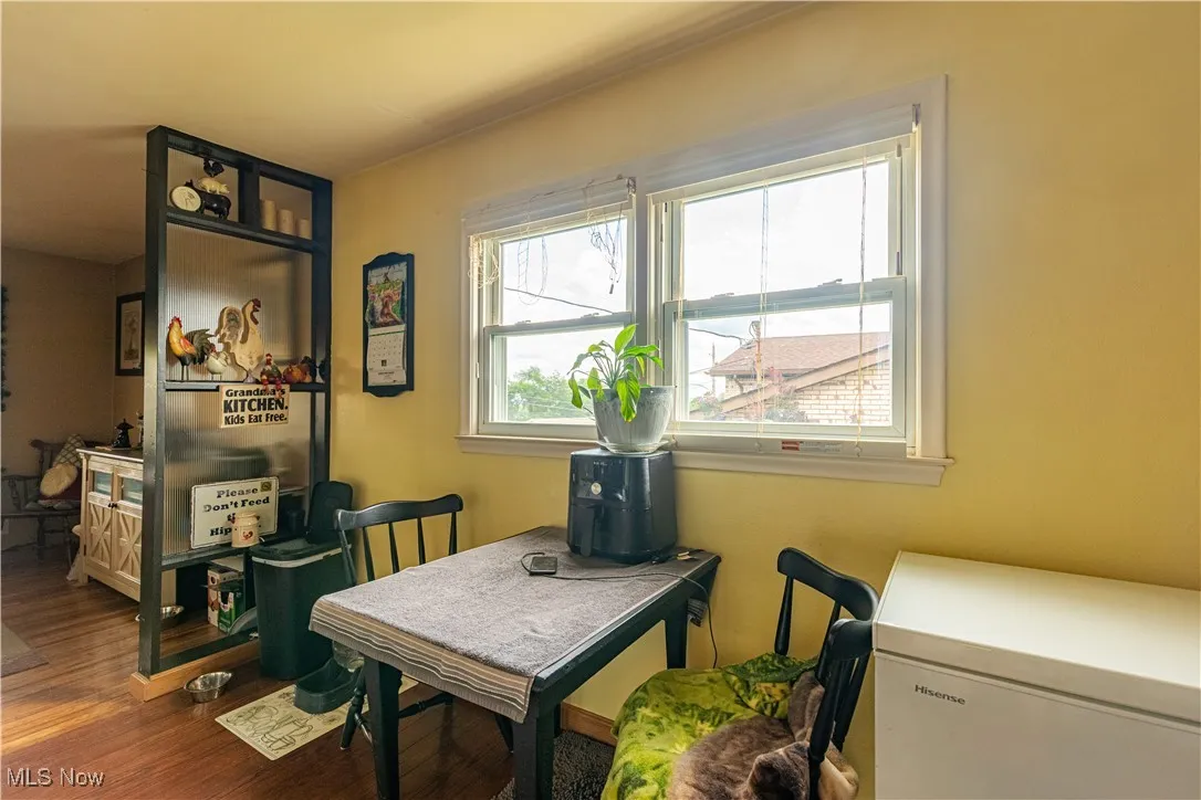 Home office with wood finished floors