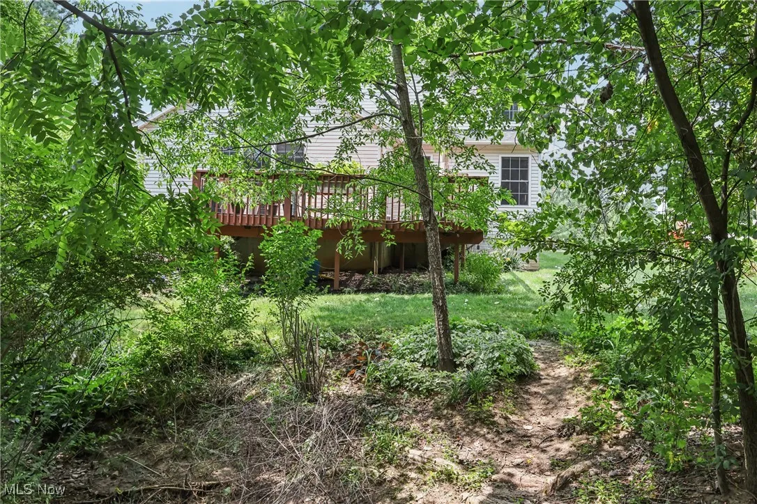 Back of house featuring a deck