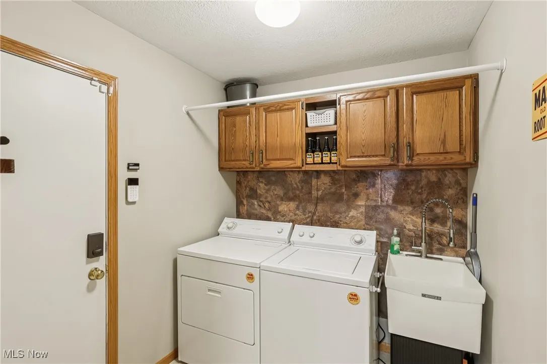First floor laundry room with utility sink