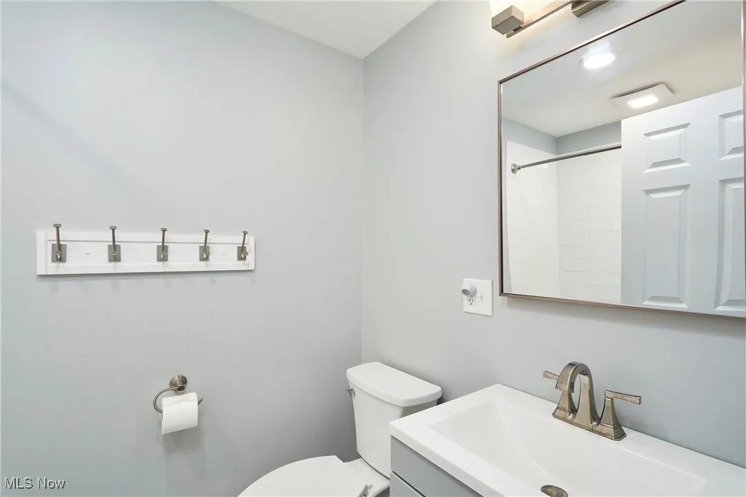 Bathroom featuring vanity and a shower
