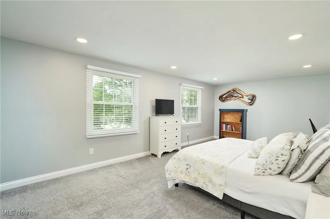 Bedroom with recessed lighting and carpet floors